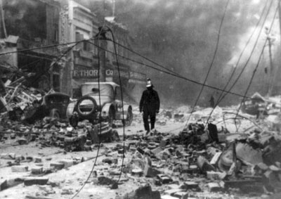 A fireman walks through rubble on a Napier street following the 1931 quake