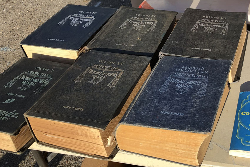 Selection of old books called Perpetual Troubleshooters Manual, see at Shelby Hamfest 2023