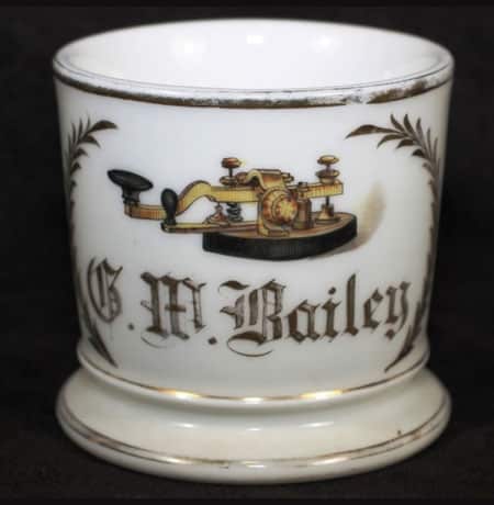 Antique shaving mug with telegraphy key and operator's name