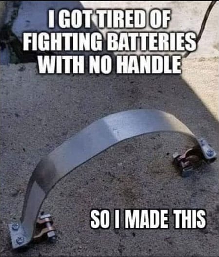 Funny photo of battery handle made of metal which clamps to the battery terminals and would short the battery