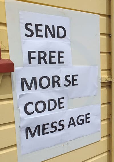 Sign announcing that passengers can send a free Morse Code message