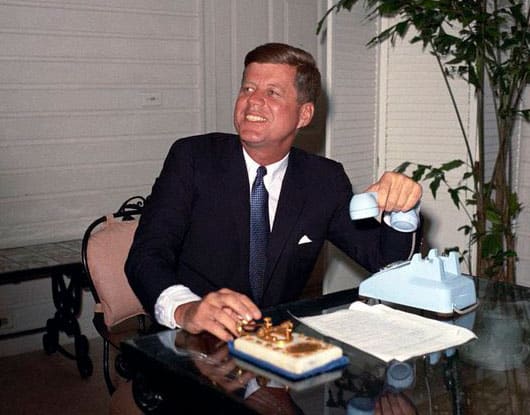 JFK pressing a gold telegraph key to open the 1962 World's Fair in Seattle