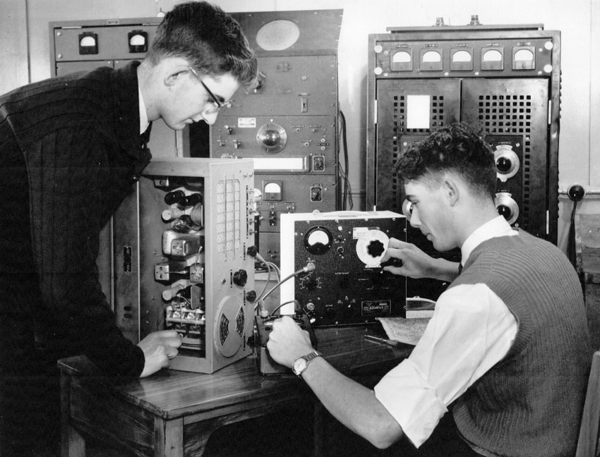 Trainees DC Moore and AE Fletcher aligning a receiver during radio training at Trentham. NZPO publicity photo